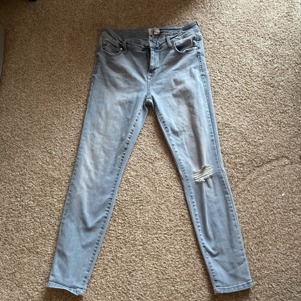 Light wash distressed skinny jeans